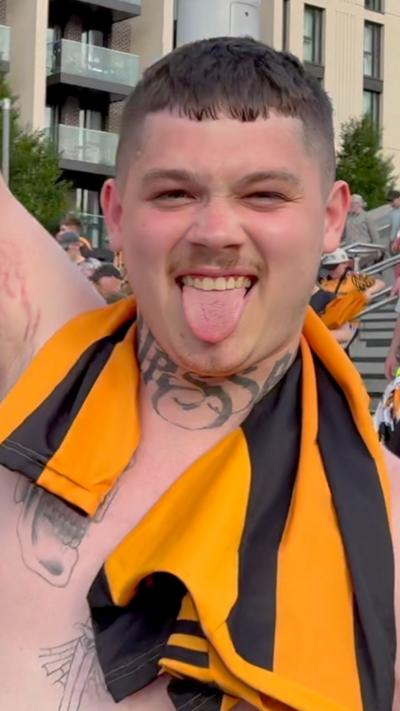 Hull City fan celebrates on Wembley Way