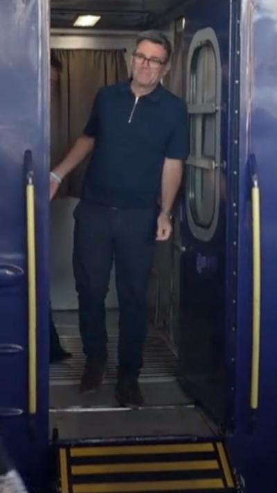 Burnham stepping off a train