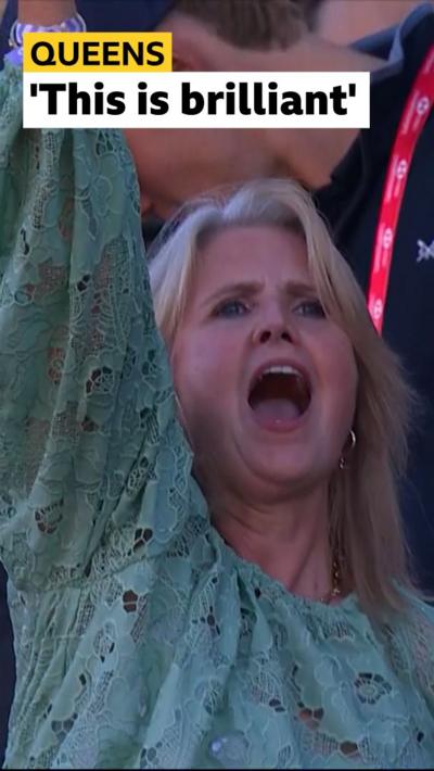 Fans dances in the crowd at Queen's