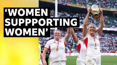England captain Zoe Aldrcoft raises the World Cup trophy and celebrates with team mate Sarah Bern