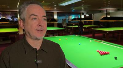 Anthony Hamilton stood by a snooker table
