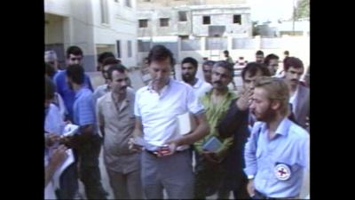 Released hostages and aid workers standing in a group