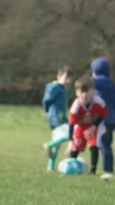 children play football