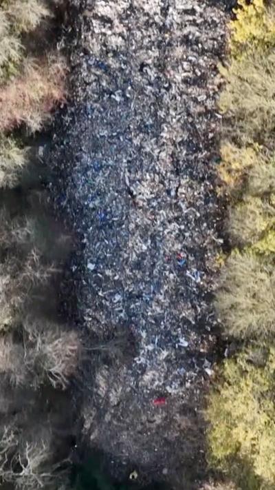 A large pile of illegally dumped waste.