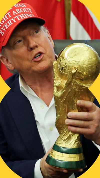Donald Trump holding the Fifa World Cup trophy in the Oval Office