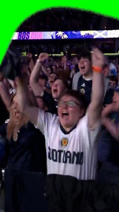 Scotland fans in Glasgow celebrate a goal