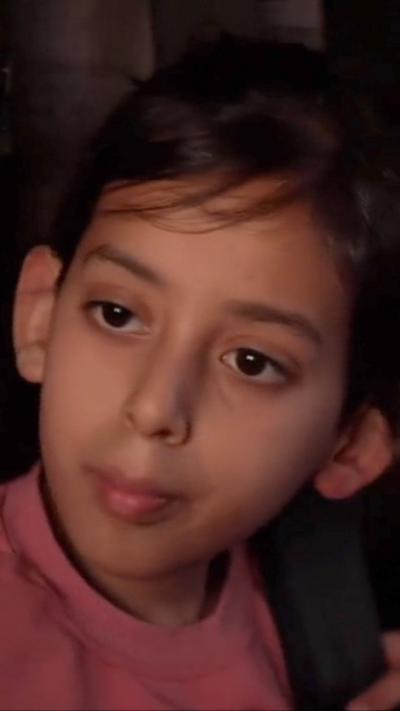 A young girl pictured as she's being evacuated from Gaza