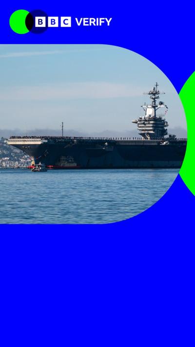 The USS Abraham Lincoln docked. The Image is imposed over the BBC Verify colours and branding. 