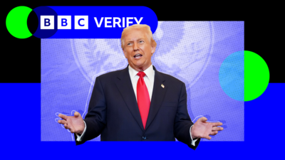 President Trump waving his hands whilst talking in front of a US government emblem