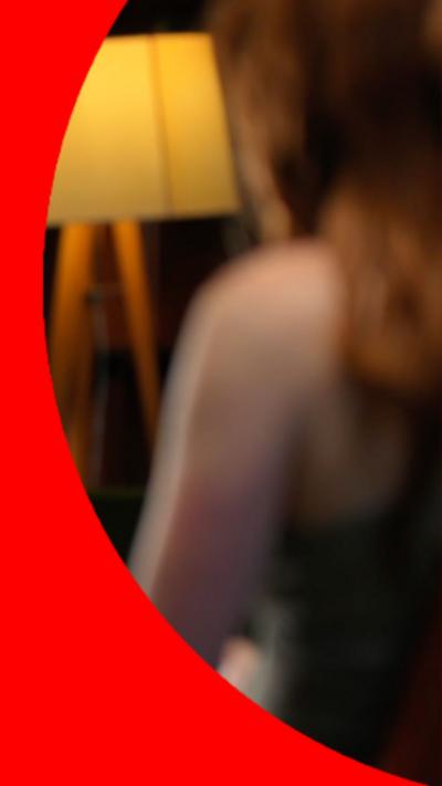 A blurred screenshot of the back of a woman's head