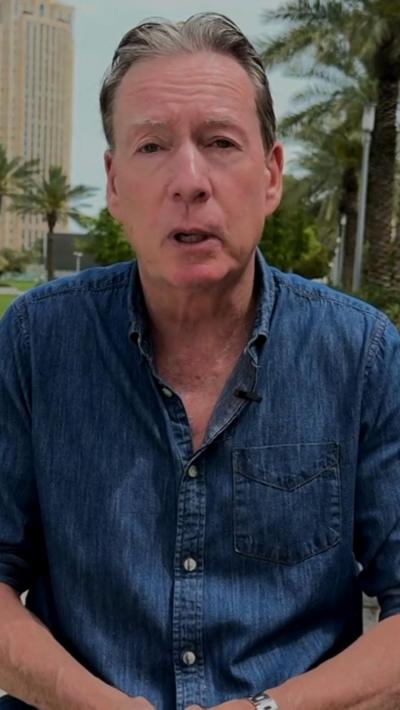 Frank Gardner wearing a blue shirt 