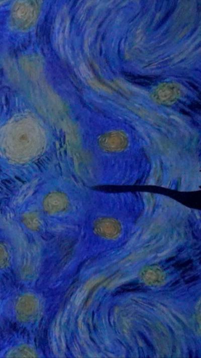 A view of blue paint swirls from Van Gogh's starry night 