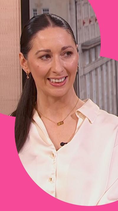 The Traitors UK joint winner Rachel Duffy. She has long brown hair and wears a white shirt.