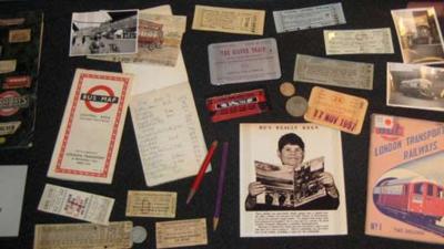 A colour picture of an assortment of travel items including a Bus map and London Transport Railways brouchure, as well as a range of tickets.