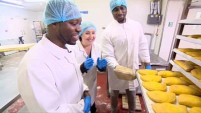 Mike from Flake Bake and a tray of Jamaican patties