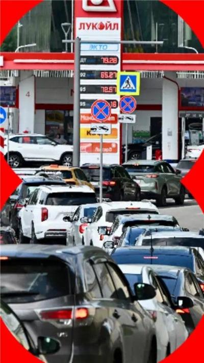 Queue of cars leading to a fuel station.