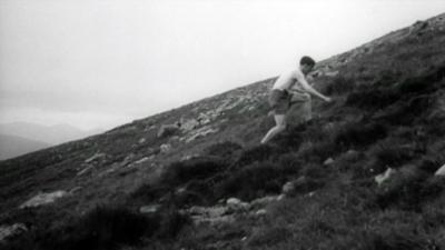 A man running up the side of Ben Nevis