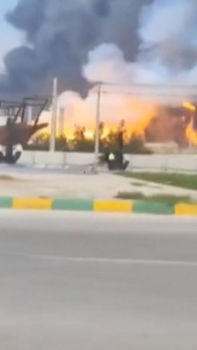 A fire and smoke in the distance