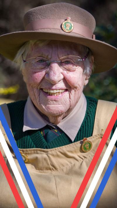 Annie Duplock in Land Army uniform smiling into the camera