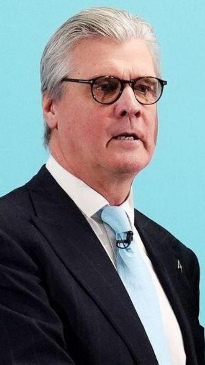 man with glasses and white hair 