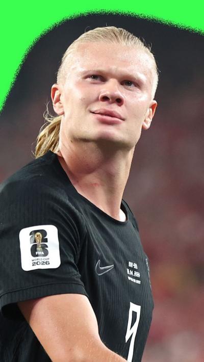 Erling Haaland celebrating a goal against Senegal. He is wearing a black Norway shirt.