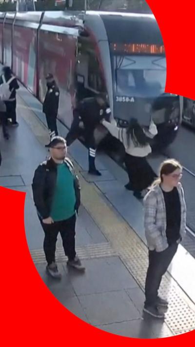 Woman pulled from front of tram