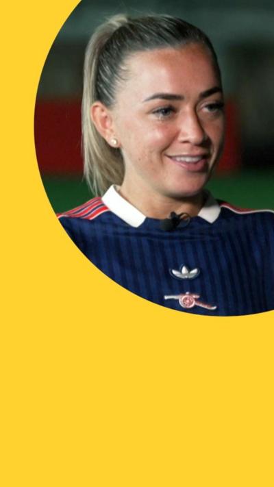 Katie McCabe looking happy and relaxed, her hair is in a high ponytail