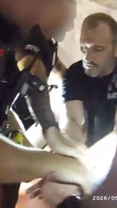 man being handcuffed by police officer