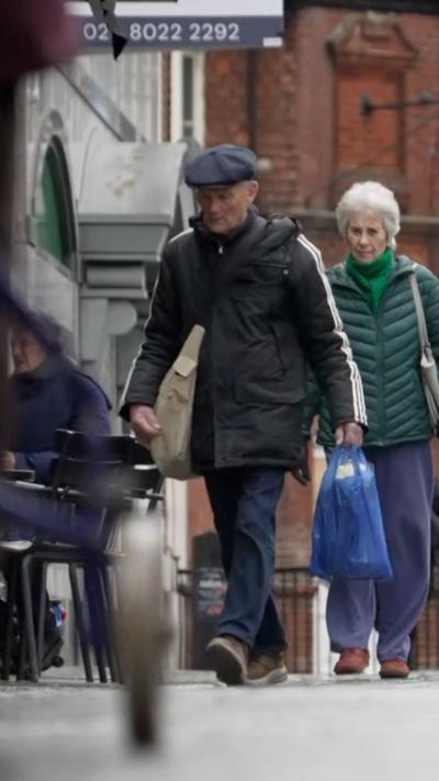 A view of shoppers walking down the High Street
