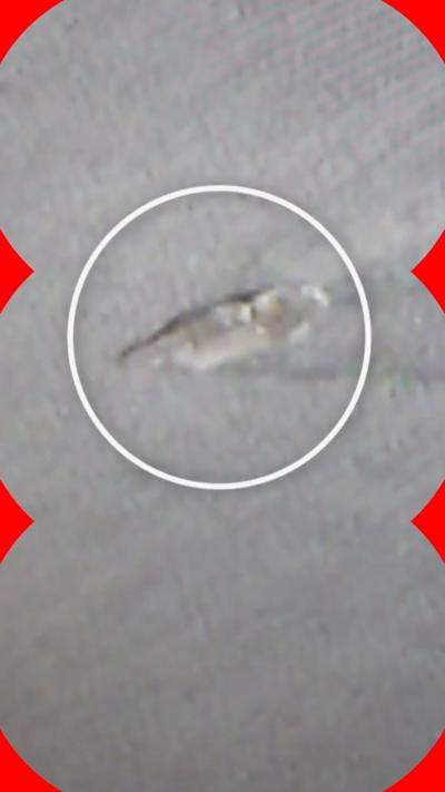 Blurry image of a US aircraft carrier as seen from above
