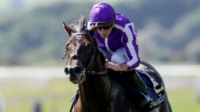 Jockey Ryan Moore in purple silks aboard winning onboard Gstaad