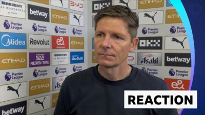 Oliver Glasner in post-match interview standing against advertising board