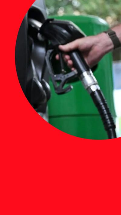 BP petrol station fuel pumps with green and black nozzles.