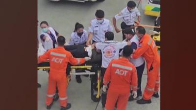 Medics surround a person on a stretcher