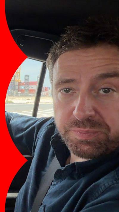 Nick Beake in a car at Dubai port