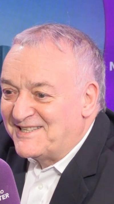 Lou Macari sat in BBC Radio Manchester studio talking to the presenter about his MBE 