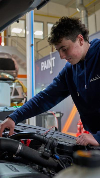 Apprentice, Liam Woodham, working on a car at Thatcham Research.