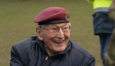 World War Two veteran Peter Davies, 102, grins broadly