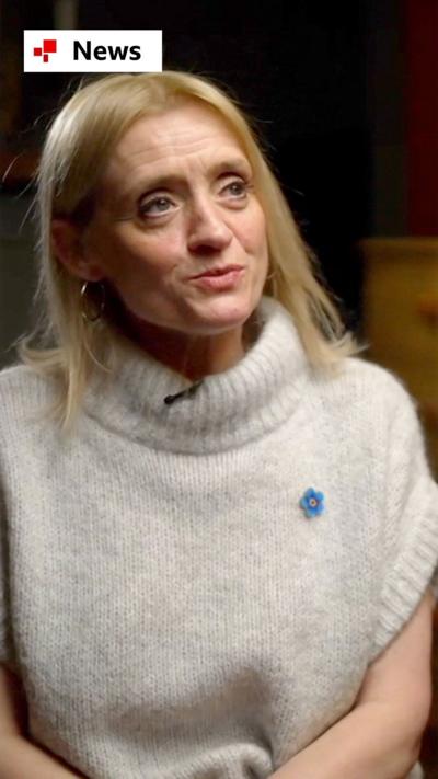 Actor Anne-Marie Duff wearing a white turtle neck jumper