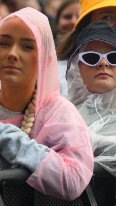 Festival-goers in ponchos