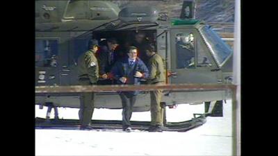 Italian Prime Minister getting out of a helicopter