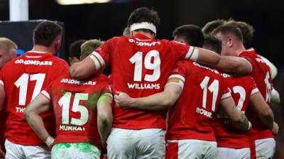 WAles players in huddle