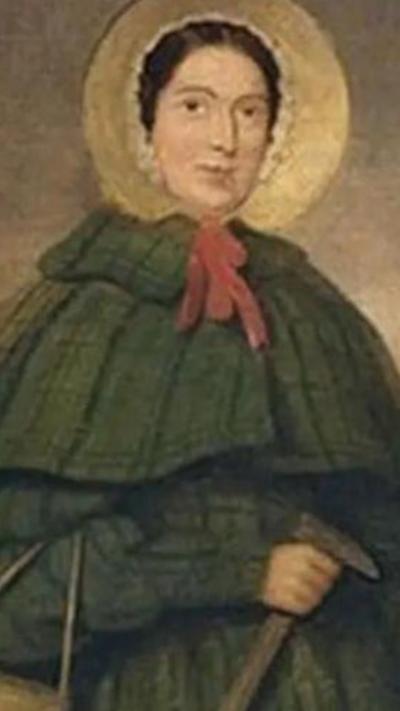 a portrait of a woman in the 19th century wearing a green cloak