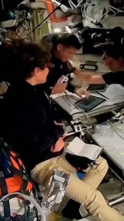 Crew members sit inside Artemis II