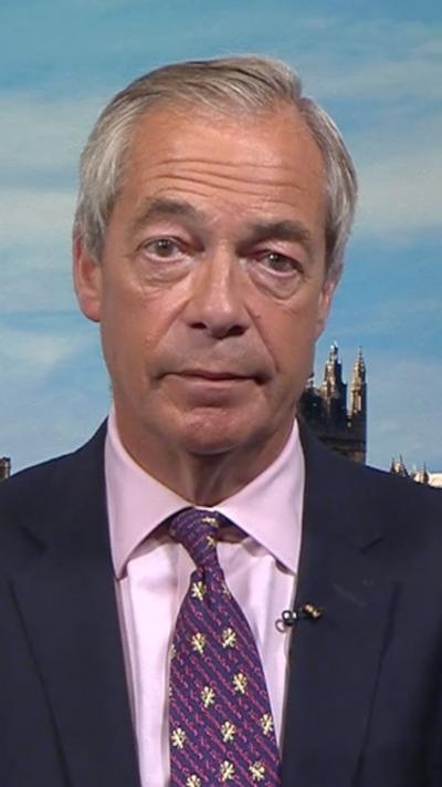 Nigel Farage in a suit and a tie