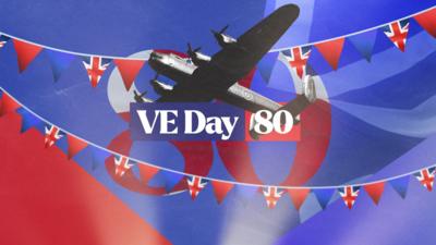 A Lancaster Bomber flies behind the words VE Day 80. There is red and blue in the background and two strings of red white and blue bunting