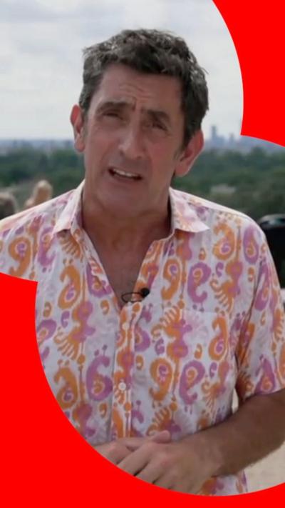 Justin Rowlatt has short dark hair and is wearing a flowery shirt.
