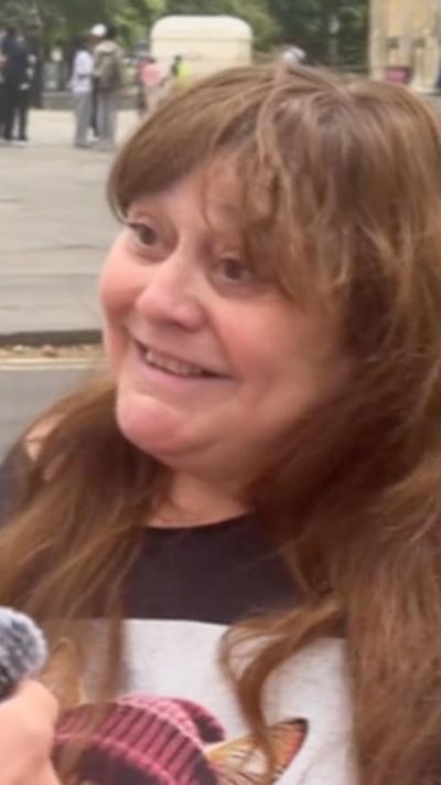 A smiling member of the public in York with long hair