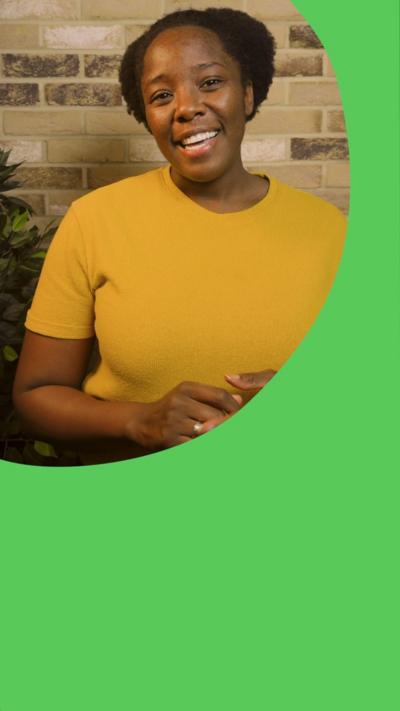 A woman speaking to camera. She wears a yellow top, with hands visible, and a graphicised pink brain floats on top