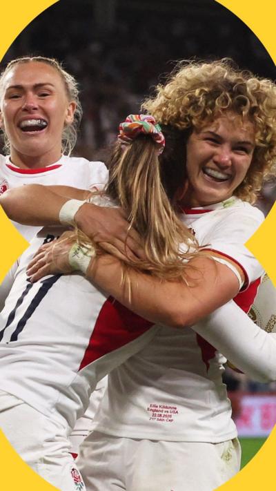 Three England female rugby players wearing white jerseys laugh, celebrating, as two hug 